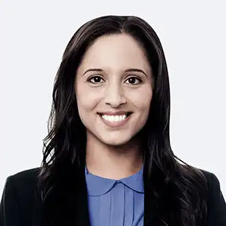 Smiling medical professional wearing a suit