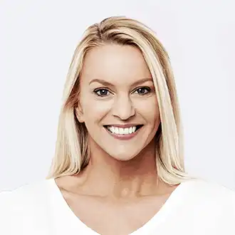 Smiling medical professional wearing a white shirt
