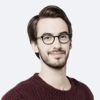 Smiling medical professional wearing eyeglasses
